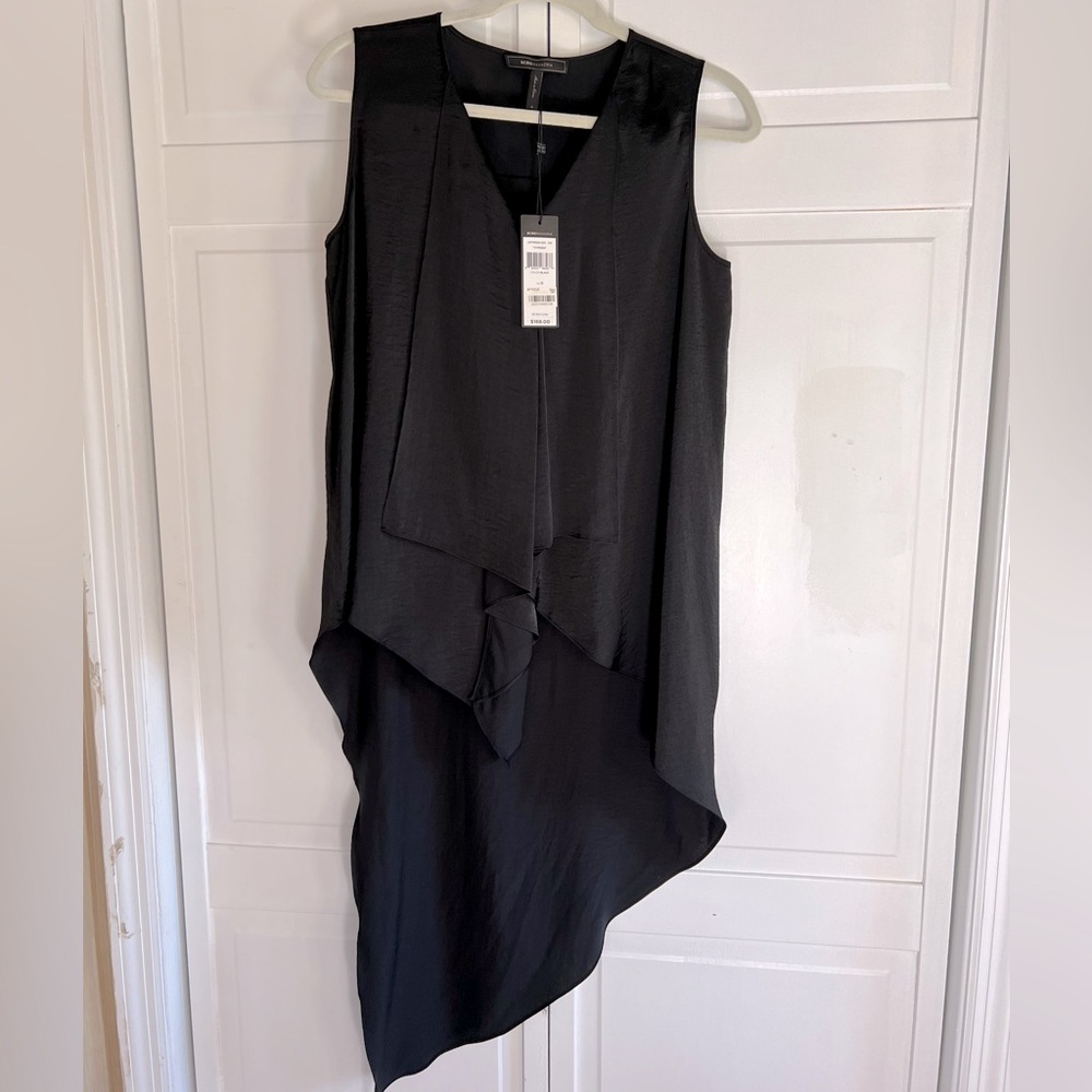 BCBG long no-sleeve blouse. Size S. Never been worn, new with tags